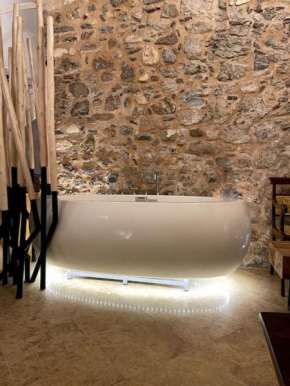 LIVING IN A CAVE UNDER ACROPOLIS